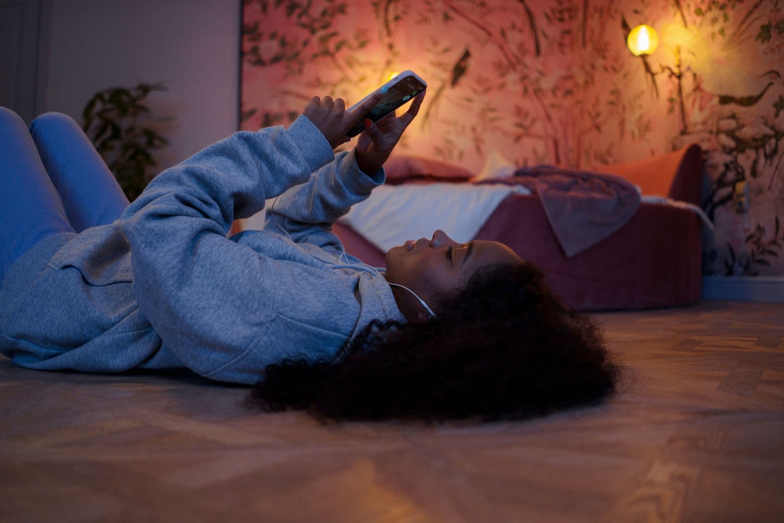 A person reviewing a plan on their phone in a bright, calm room